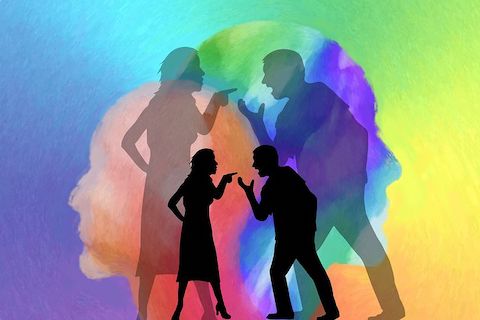 Multicolored background with silhouettes of couples arguing, expressing conflict. 
