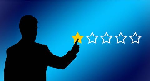 Black silhouette of a man giving a 1/5 star review with a blue background. The star is golden in color. 