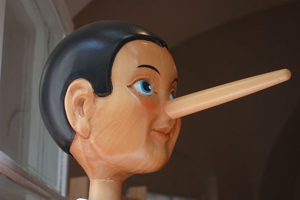 Pinocchio, with an extended nose showing that he is lying. 